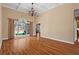 Bright and airy living room with hardwood floors, high ceilings, and a large window at 423 Morgan Falls Chase, Canton, GA 30114