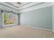 Bright main bedroom with tray ceiling, ceiling fan and large windows allowing lots of natural light at 423 Morgan Falls Chase, Canton, GA 30114