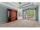 Spacious main bedroom features tray ceilings, carpet flooring, and a large window at 423 Morgan Falls Chase, Canton, GA 30114