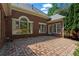 A spacious brick patio that overlooks a lush green garden, perfect for outdoor entertainment at 423 Morgan Falls Chase, Canton, GA 30114