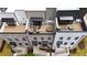 Aerial view of upscale townhomes with rooftop terraces including outdoor kitchens and lounge seating at 4812 Moonview Ln # 4, Sugar Hill, GA 30518