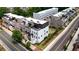 Aerial view of modern townhomes with rooftop terraces and private outdoor lounge areas at 4812 Moonview Ln # 4, Sugar Hill, GA 30518