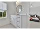 Bathroom featuring single vanity with window and bedroom view at 4812 Moonview Ln # 4, Sugar Hill, GA 30518