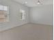 Bright unfurnished bedroom with carpet and two windows at 4812 Moonview Ln # 4, Sugar Hill, GA 30518