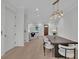 Open concept dining and living area with modern fixtures and plenty of natural light at 4812 Moonview Ln # 4, Sugar Hill, GA 30518