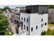 New townhomes featuring brick and painted exteriors with black window frames and awning-covered entryways at 4812 Moonview Ln # 4, Sugar Hill, GA 30518