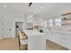 Modern kitchen features white cabinets, stainless steel appliances, a large island, and stylish lighting at 4812 Moonview Ln # 4, Sugar Hill, GA 30518
