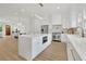 Gourmet kitchen featuring an island with seating, stainless steel appliances, and a seamless flow to dining area at 4812 Moonview Ln # 4, Sugar Hill, GA 30518