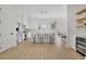 Modern kitchen with stainless appliances, quartz counters, white cabinets, and an adjacent dining area at 4812 Moonview Ln # 4, Sugar Hill, GA 30518