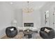 This bright living room features a fireplace, modern lighting, comfortable seating, and lots of natural light at 4812 Moonview Ln # 4, Sugar Hill, GA 30518