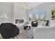 Bright living room features a fireplace, modern lighting, and comfortable seating with large windows for natural light at 4812 Moonview Ln # 4, Sugar Hill, GA 30518
