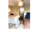 Spacious bedroom with hardwood floors and a serene view of the ensuite bathroom at 506 Park Ridge Cir, Marietta, GA 30068