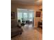 Inviting living room featuring large windows, a desk, and comfortable seating area at 506 Park Ridge Cir, Marietta, GA 30068
