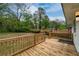 A spacious wooden deck overlooks the expansive and private backyard with mature trees at 733 Pegg Sw Rd, Atlanta, GA 30315