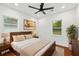 This bedroom has natural light, neutral walls, ceiling fan and wood furniture at 733 Pegg Sw Rd, Atlanta, GA 30315