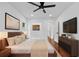 Bright bedroom features a ceiling fan, recessed lights, and stylish contemporary decor at 733 Pegg Sw Rd, Atlanta, GA 30315