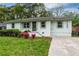 Charming single-story home with fresh white paint, dark trim and a well-manicured lawn at 733 Pegg Sw Rd, Atlanta, GA 30315