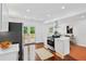 Well-designed kitchen with stainless appliances, and access to the outdoor deck at 733 Pegg Sw Rd, Atlanta, GA 30315