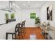 Eat-in kitchen with breakfast bar seating and French doors leading to the outdoor space at 733 Pegg Sw Rd, Atlanta, GA 30315