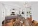 Open-concept living space with hardwood floors, seamlessly connecting living, dining, and kitchen areas at 733 Pegg Sw Rd, Atlanta, GA 30315