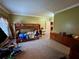 A bedroom is carpeted and features a bunk bed at 1049 Panola Rd, Ellenwood, GA 30294
