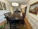 Traditional dining room features a long table with seating for six and neutral decor at 1049 Panola Rd, Ellenwood, GA 30294