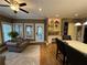A cozy seating area sits off the kitchen, featuring built-in shelves and hardwood floors at 1049 Panola Rd, Ellenwood, GA 30294