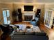 Cozy living room with a fireplace, hardwood floors, and comfortable seating at 1049 Panola Rd, Ellenwood, GA 30294