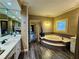Beautiful bathroom featuring tub, double vanity and tile floors at 1049 Panola Rd, Ellenwood, GA 30294