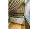 Compact wet bar featuring a sink and cabinetry at 1049 Panola Rd, Ellenwood, GA 30294