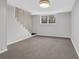 Finished basement space with stairs, window, neutral carpet, and bright lighting at 1531 Piedmont Ne Rd, Marietta, GA 30066
