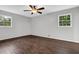 Spacious bedroom with dark hardwood flooring, gray walls, and bright, natural light at 1531 Piedmont Ne Rd, Marietta, GA 30066