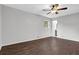 Bedroom features hardwood floors, neutral paint, ceiling fan, and bright natural light at 1531 Piedmont Ne Rd, Marietta, GA 30066