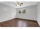 Cozy bedroom with hardwood floors, closet, and natural light from the window at 1531 Piedmont Ne Rd, Marietta, GA 30066