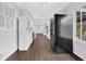 Galley kitchen with modern appliances and hardwood floors at 1531 Piedmont Ne Rd, Marietta, GA 30066