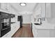 Bright kitchen featuring white cabinets, granite countertops, and stainless steel appliances at 1531 Piedmont Ne Rd, Marietta, GA 30066