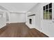 The airy living room features hardwood floors, fireplace, fresh paint, and natural light at 1531 Piedmont Ne Rd, Marietta, GA 30066