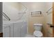 Full bathroom features safety bar, walk-in tub and patterned wall paper at 2003 Graystone Pkwy, Grayson, GA 30017
