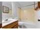 Full bath featuring tub-shower combo, single sink and patterned wallpaper at 2003 Graystone Pkwy, Grayson, GA 30017
