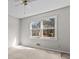Sunny bedroom featuring carpeted floors and large windows at 2003 Graystone Pkwy, Grayson, GA 30017