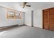 Bedroom with carpet and a window alongside a closet with bi-fold doors at 2003 Graystone Pkwy, Grayson, GA 30017