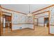 Dining room with chandelier, wood trim, and access to the updated kitchen at 2003 Graystone Pkwy, Grayson, GA 30017