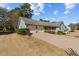View of the home's exterior featuring blue siding, a two-car garage, and a wide driveway, showcasing curb appeal at 2003 Graystone Pkwy, Grayson, GA 30017