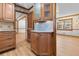 Classic kitchen features wood cabinets, granite countertops, and views to the living area at 2003 Graystone Pkwy, Grayson, GA 30017