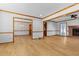 Spacious living room with wood-look floors, a ceiling fan, and an adjoining dining area at 2003 Graystone Pkwy, Grayson, GA 30017