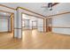 Expansive living room with hardwood floors, neutral walls, and connections to various rooms at 2003 Graystone Pkwy, Grayson, GA 30017