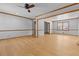 Spacious living room with beautiful wood trim, flooring and a ceiling fan at 2003 Graystone Pkwy, Grayson, GA 30017