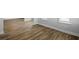Bright living room featuring light, wood-look floors and white trim at 3240 Lions Ruby Ln, Atlanta, GA 30349