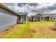 Inviting backyard with a screened porch, offering a comfortable space to enjoy the outdoors and surrounding views at 3855 Shelleydale Dr, Powder Springs, GA 30127