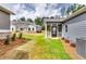 Spacious backyard featuring a screened porch, providing a perfect blend of indoor and outdoor living at 3855 Shelleydale Dr, Powder Springs, GA 30127